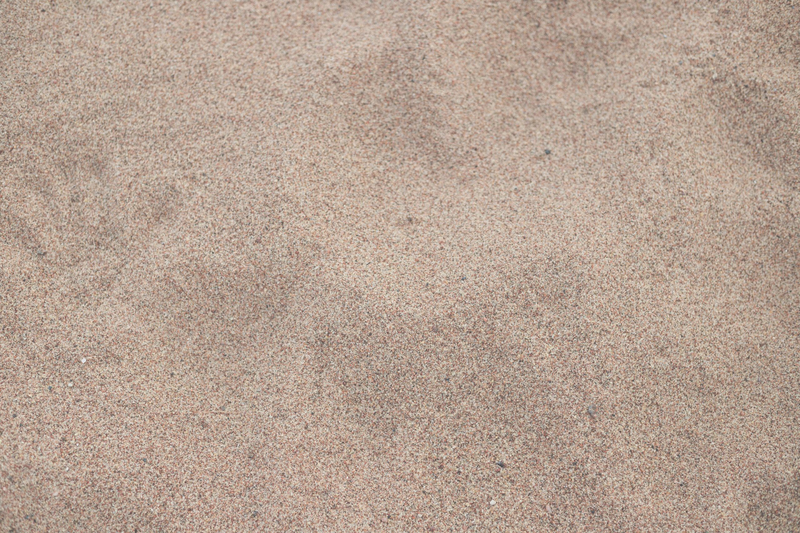 Detailed close-up of beach sand texture in Hiiu County, Estonia, showcasing natural patterns.