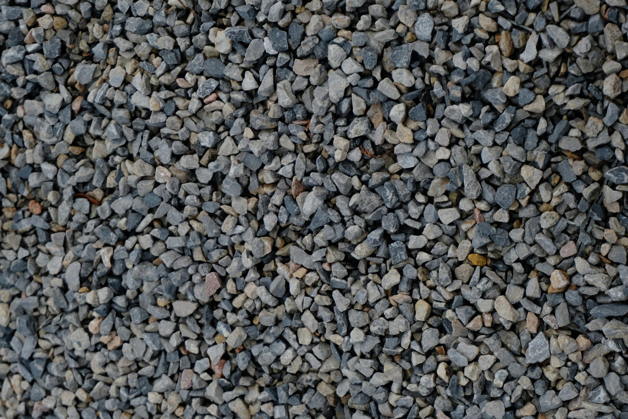 High-resolution image of crushed gravel stones, ideal for construction and landscaping projects.