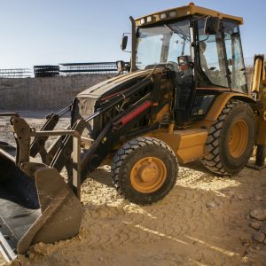 excavator digging ground day light