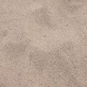 Detailed close-up of beach sand texture in Hiiu County, Estonia, showcasing natural patterns.